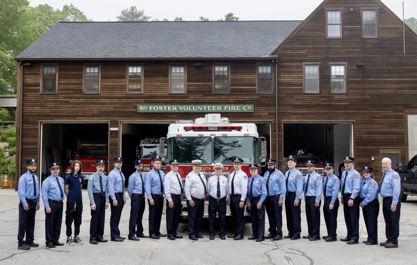 Members of the South Foster Volunteer Fire Company in front of the station.